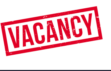 A bold red stamp with the word "VACANCY" in capital letters is displayed on a white background. The stamp has a slightly distressed, textured appearance.